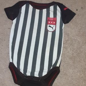 Black and white striped puma onesie